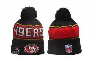 NFL San Francisco 49ers New Era Black 2024 Sideline Sport Cuffed Knit Beanie Hat With Pom 5030