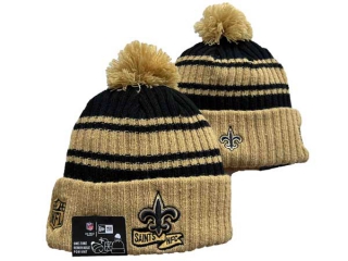 NFL New Orleans Saints New Era Gold Black 2022 Sideline Sport Cuffed Pom Knit Hat 3041